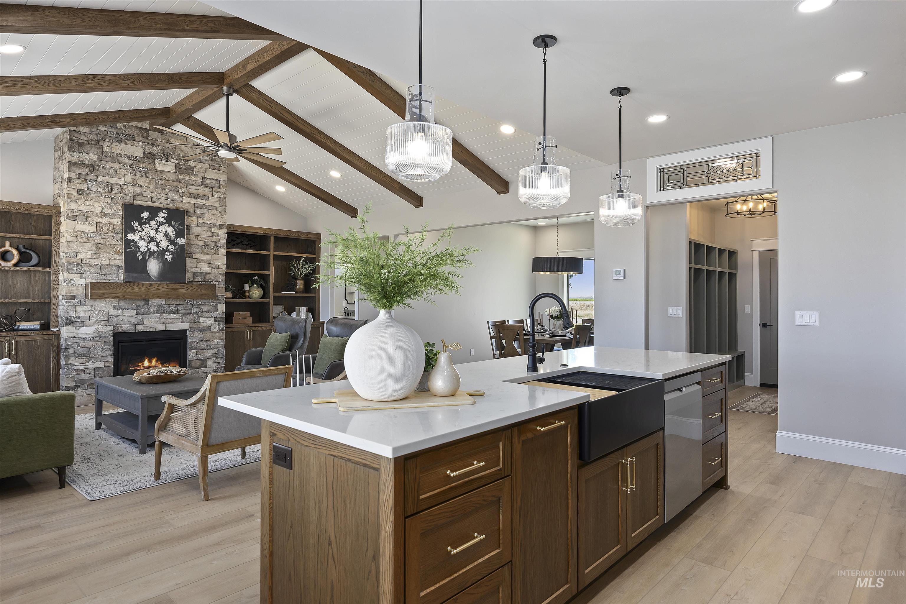 378 West 100 South Rupert, ID 83350 - Photo 17 of 50 Open-concept kitchen featuring a quartz-topped island with a matte black farmhouse sink and stainless steel dishwasher