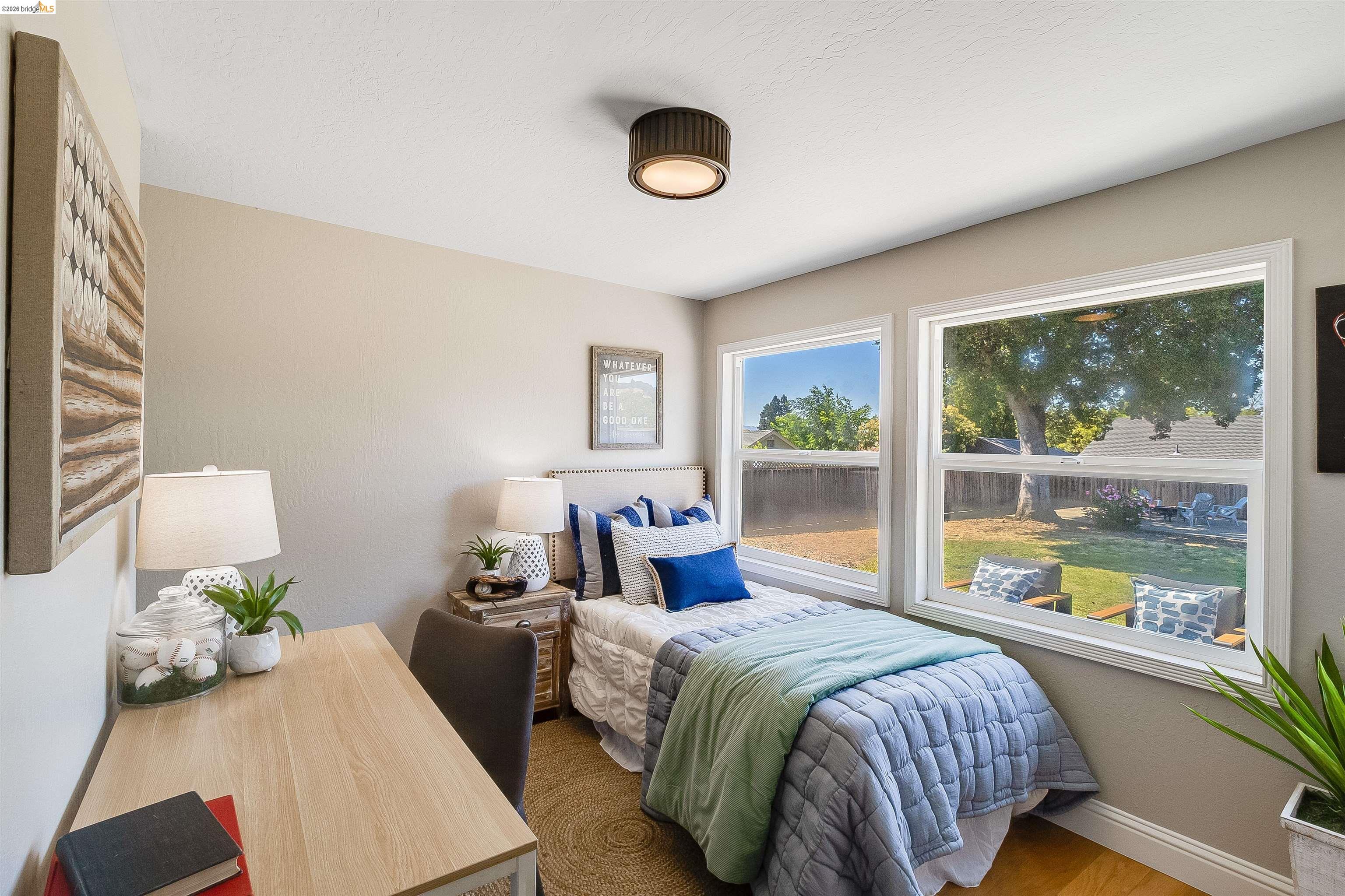 346 Valley View Road Pleasant Hill, CA 94523 - Photo 33 of 57 Bedroom featuring hardwood-finish flooring, two large windows, a neutral wall color, and a modern drum ceiling light fixture