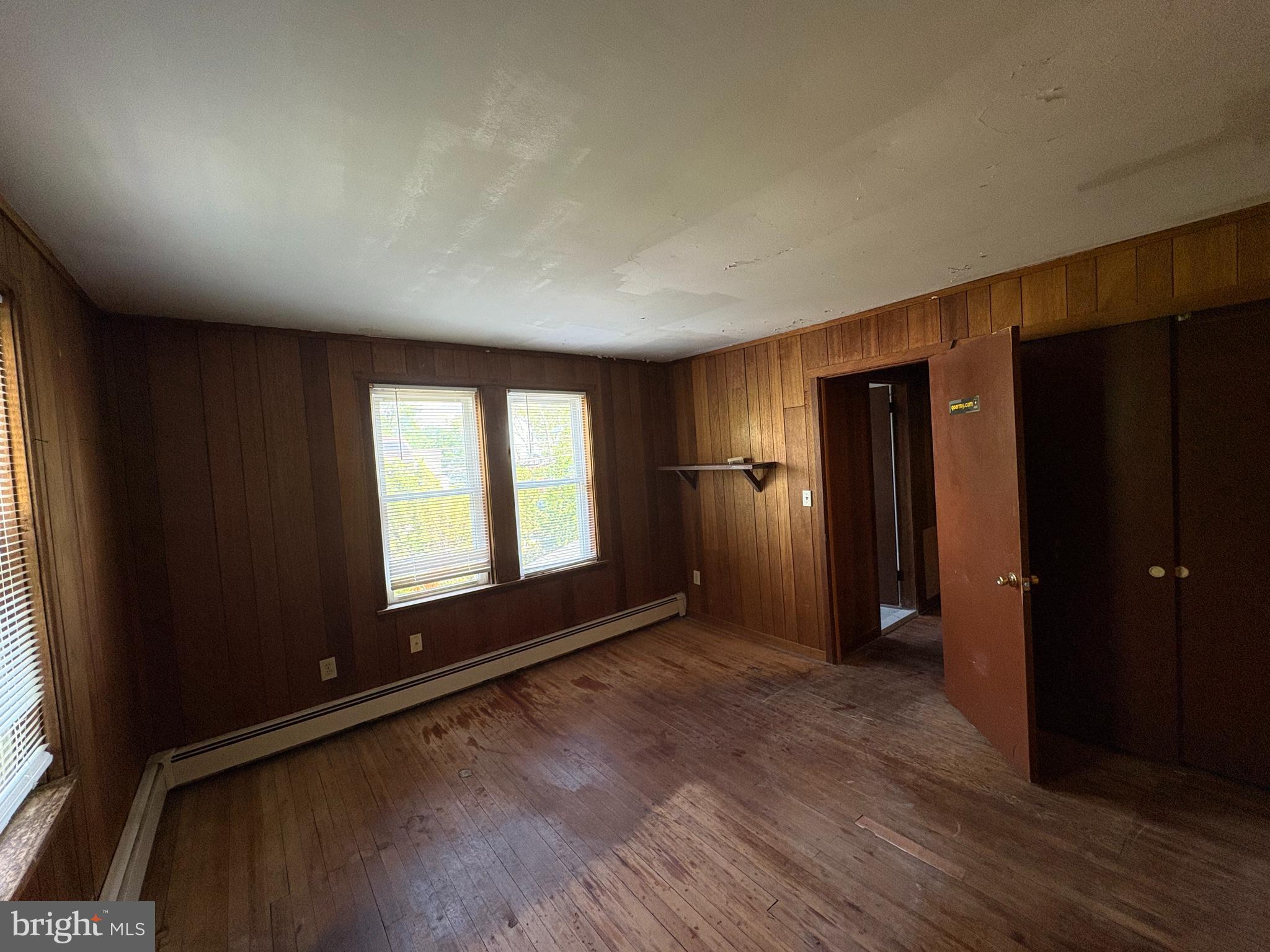 1405 Pennington Road, Unit 2A Ewing, NJ 08618 - Photo 6 of 12 wooden floor in an empty room with a window