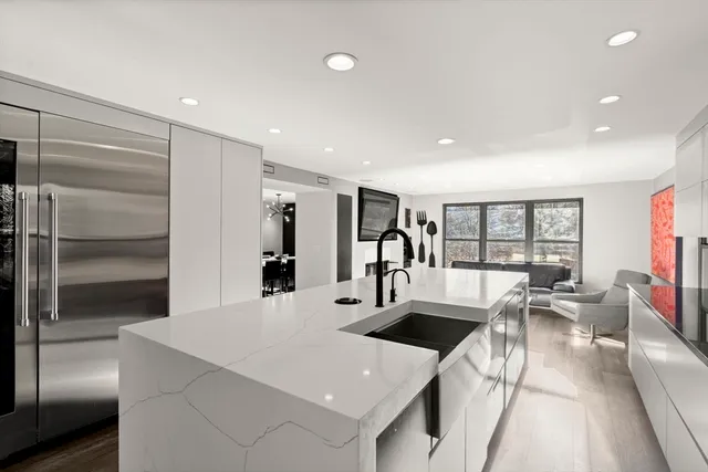 a kitchen with counter top space cabinets and stainless steel appliances
