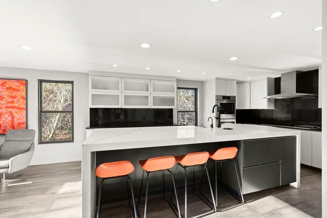 a large kitchen with a table and chairs