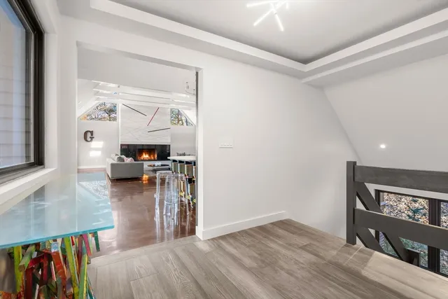 a view of a living room and a wooden floor