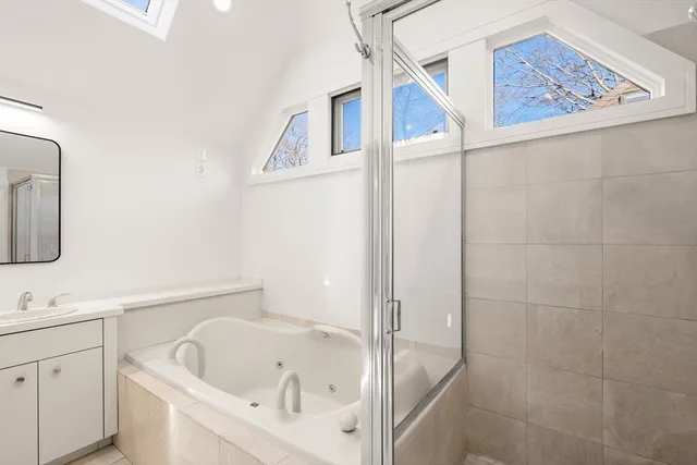 a bathroom with a bathtub and a sink