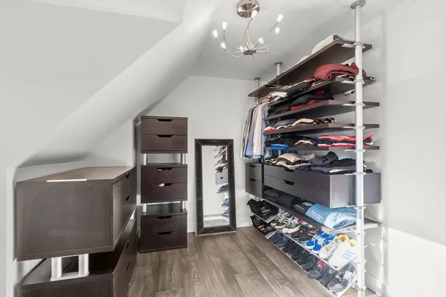 a view of a living room with clothes and shoes