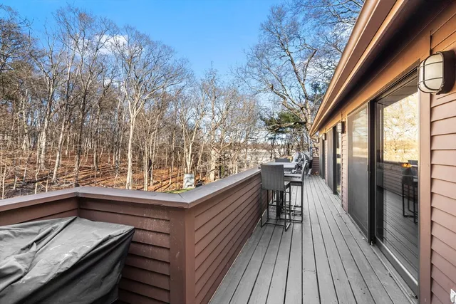 a view of balcony with furniture and wooden floor