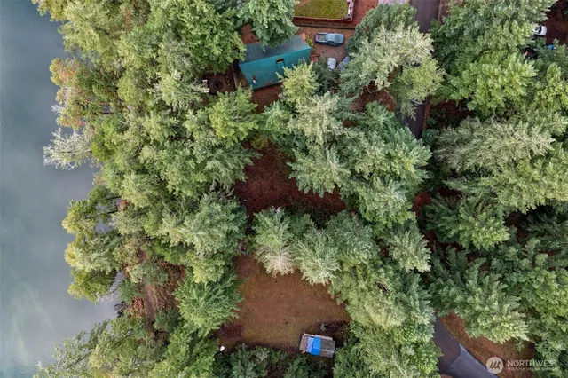 an aerial view of a house with a yard