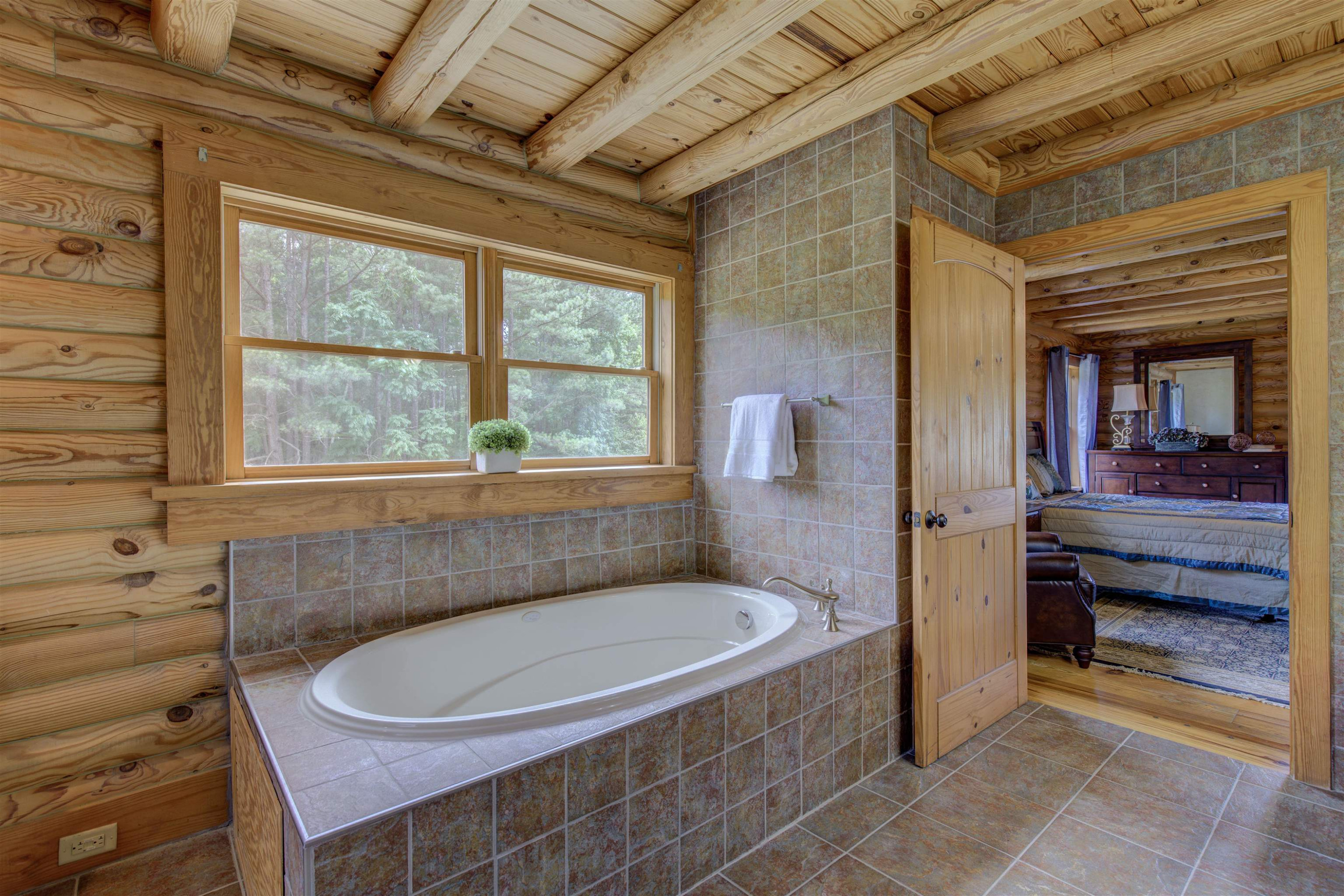1039 North Chavis Road Kittrell, NC 27544 - Photo 24 of 53 a bathroom with a sink and bathtub