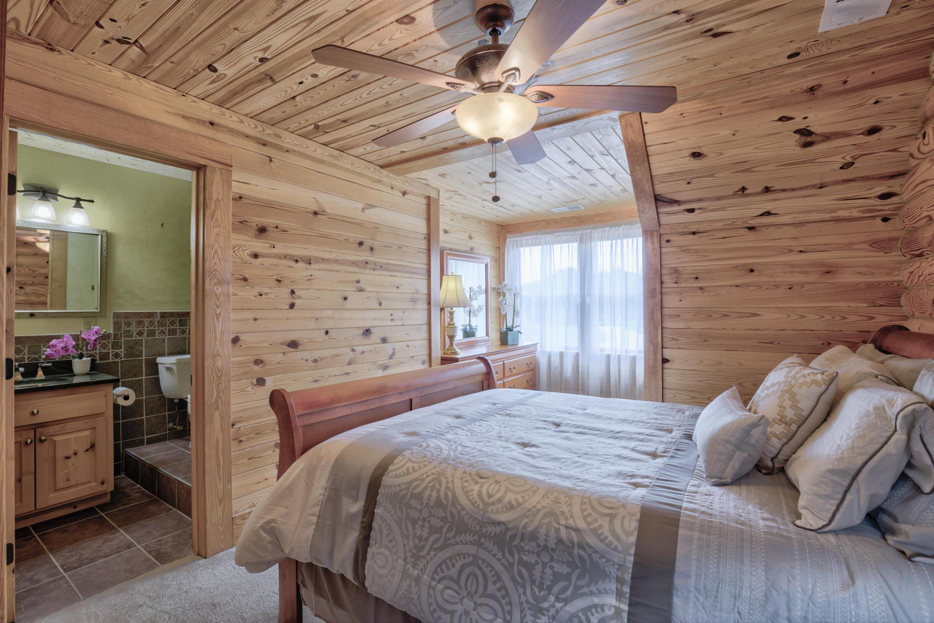 1039 North Chavis Road Kittrell, NC 27544 - Photo 27 of 53 a bedroom with a bed and a chandelier