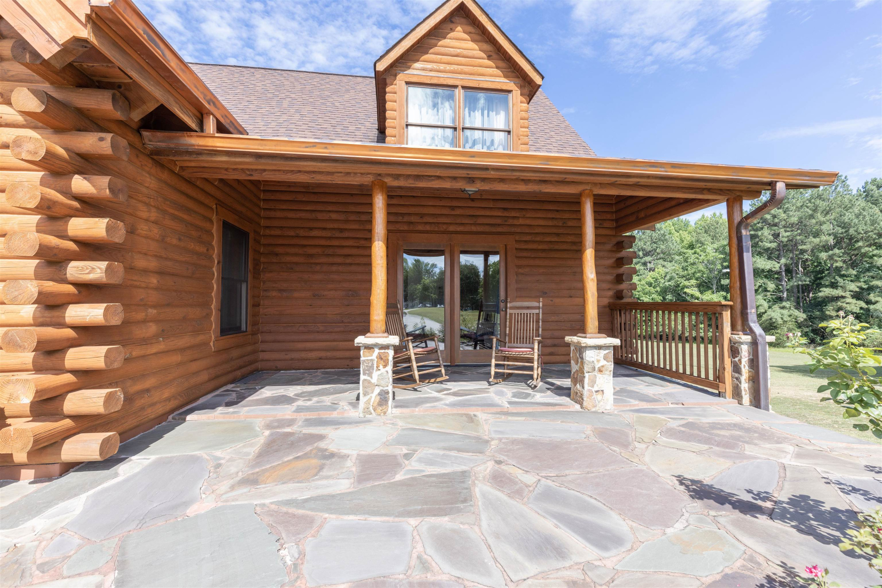 1039 North Chavis Road Kittrell, NC 27544 - Photo 32 of 53 a backyard of a house with garden and outdoor seating