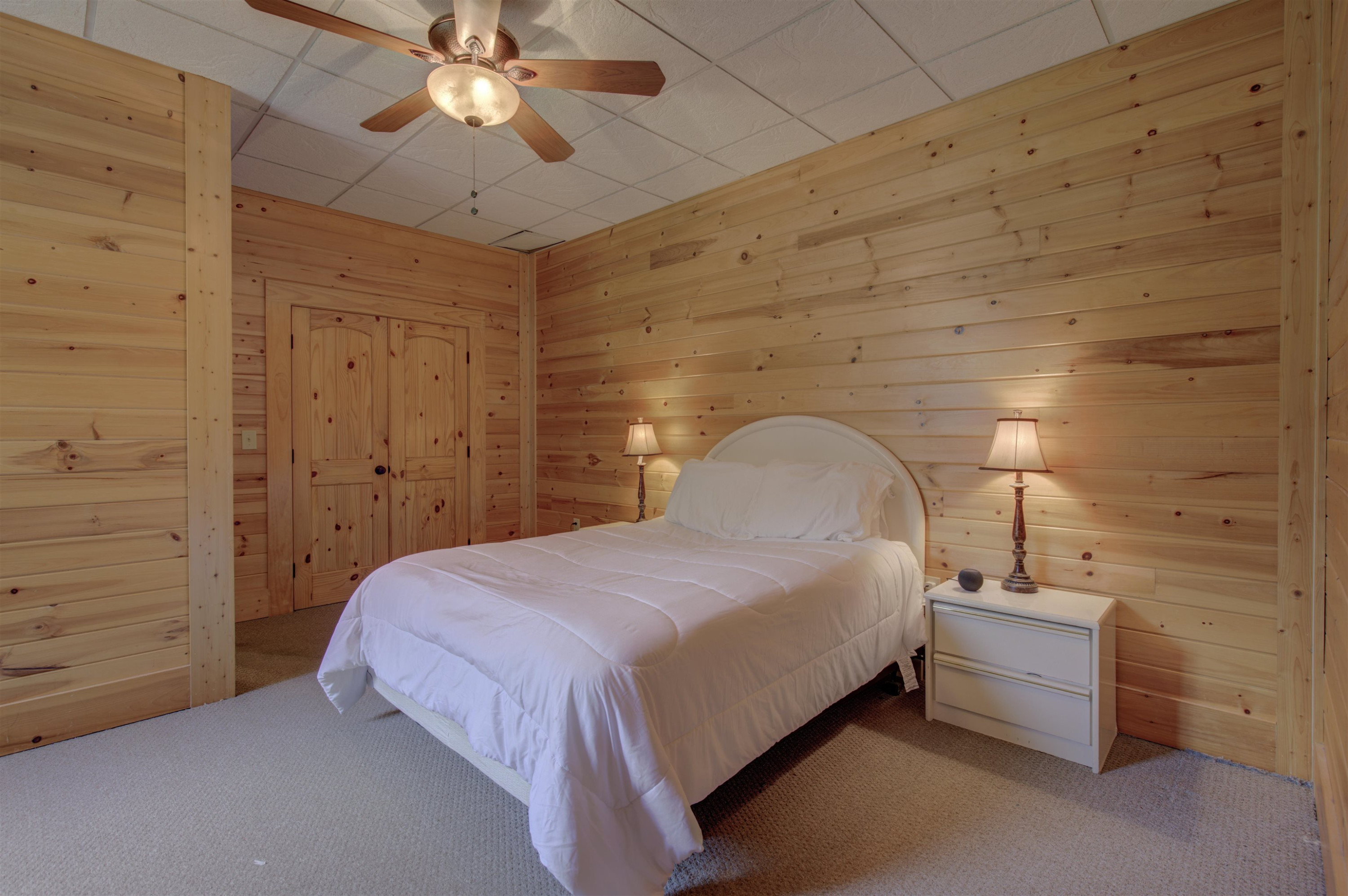 1039 North Chavis Road Kittrell, NC 27544 - Photo 34 of 53 a bedroom with a bed and a chandelier