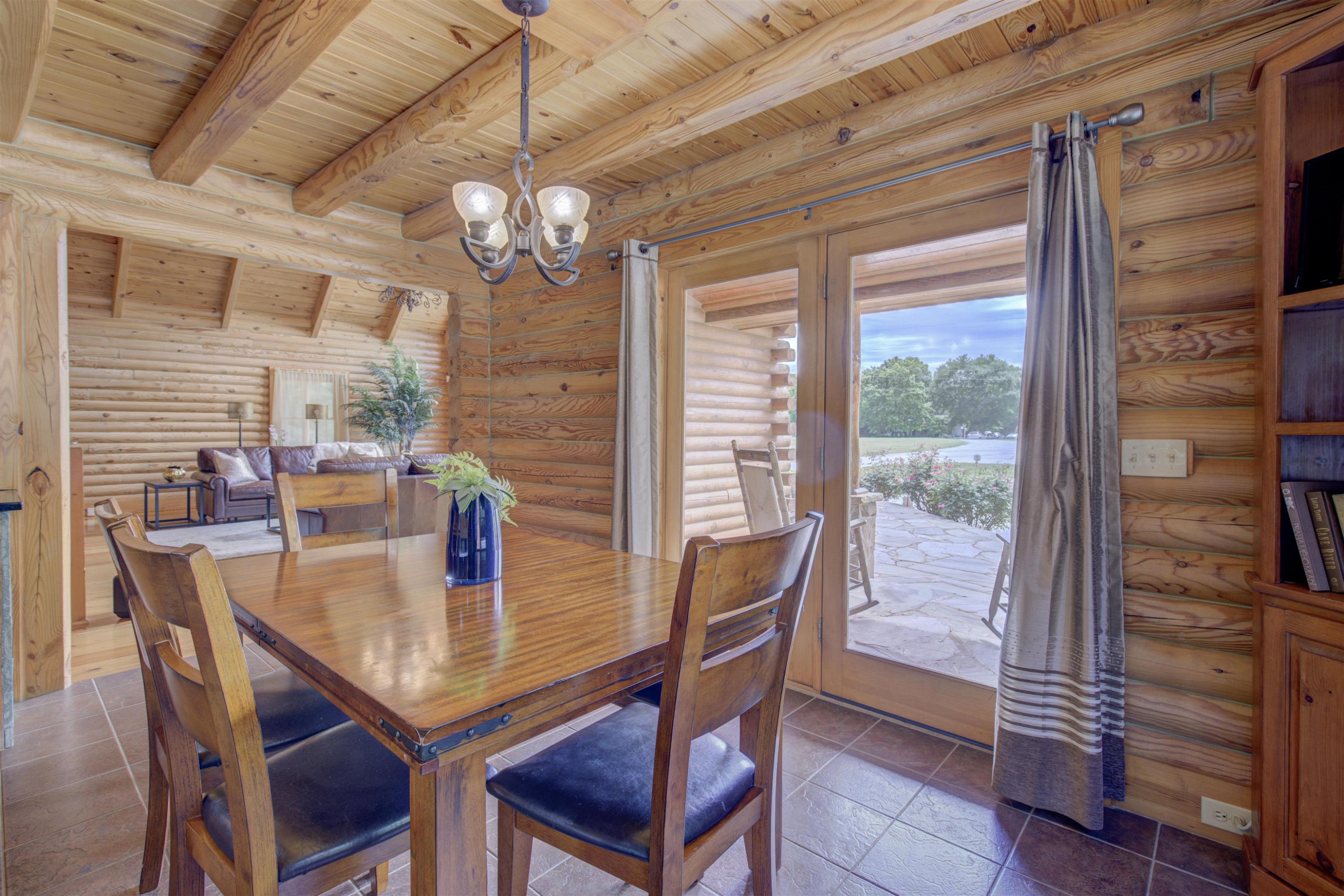 1039 North Chavis Road Kittrell, NC 27544 - Photo 40 of 53 a view of a dining room with furniture window and wooden floor