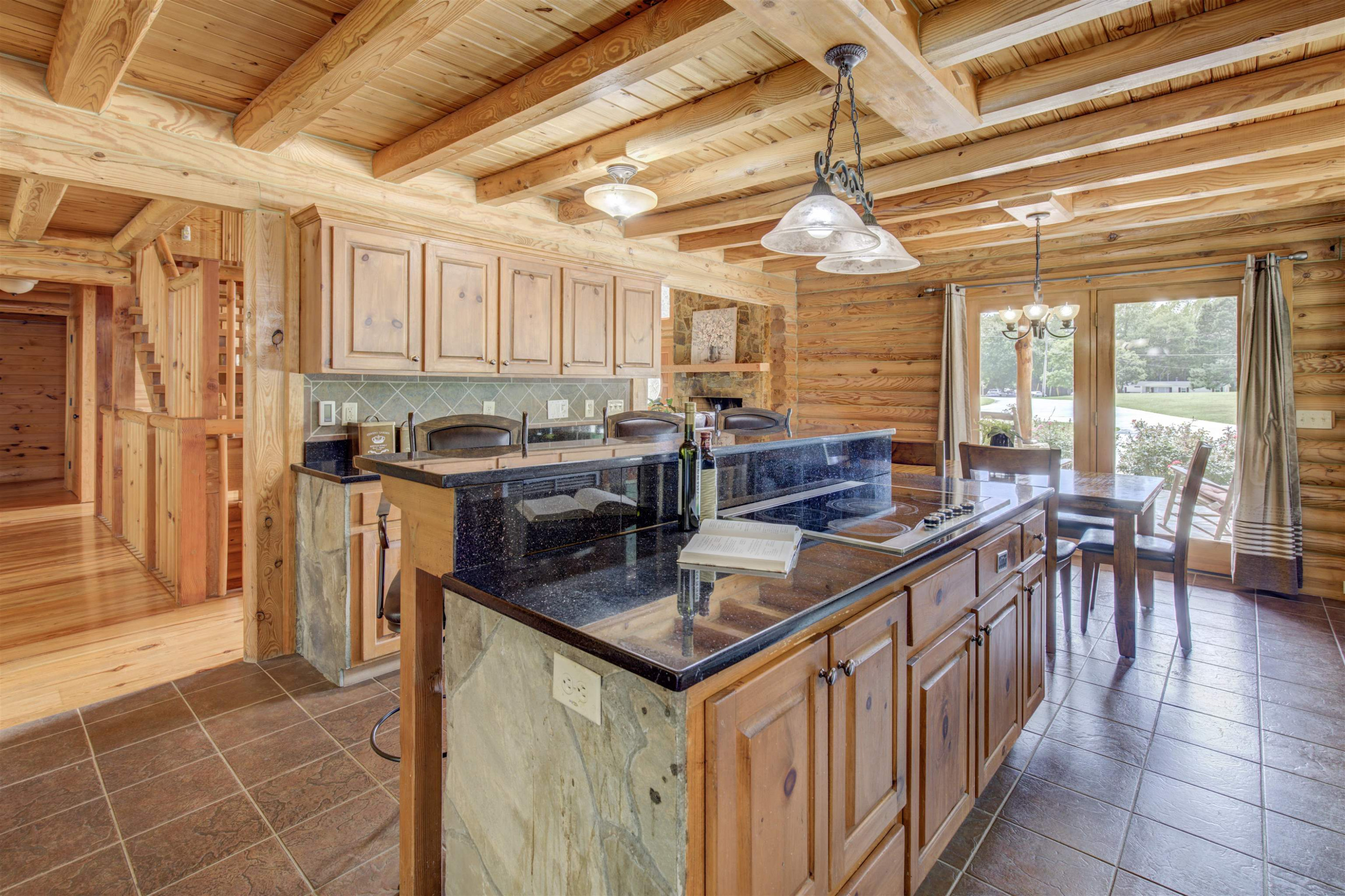 1039 North Chavis Road Kittrell, NC 27544 - Photo 41 of 53 a kitchen with stainless steel appliances granite countertop a stove a refrigerator a sink and white cabinets