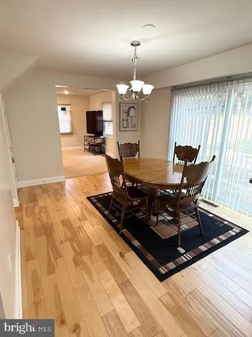 a living room with dining table