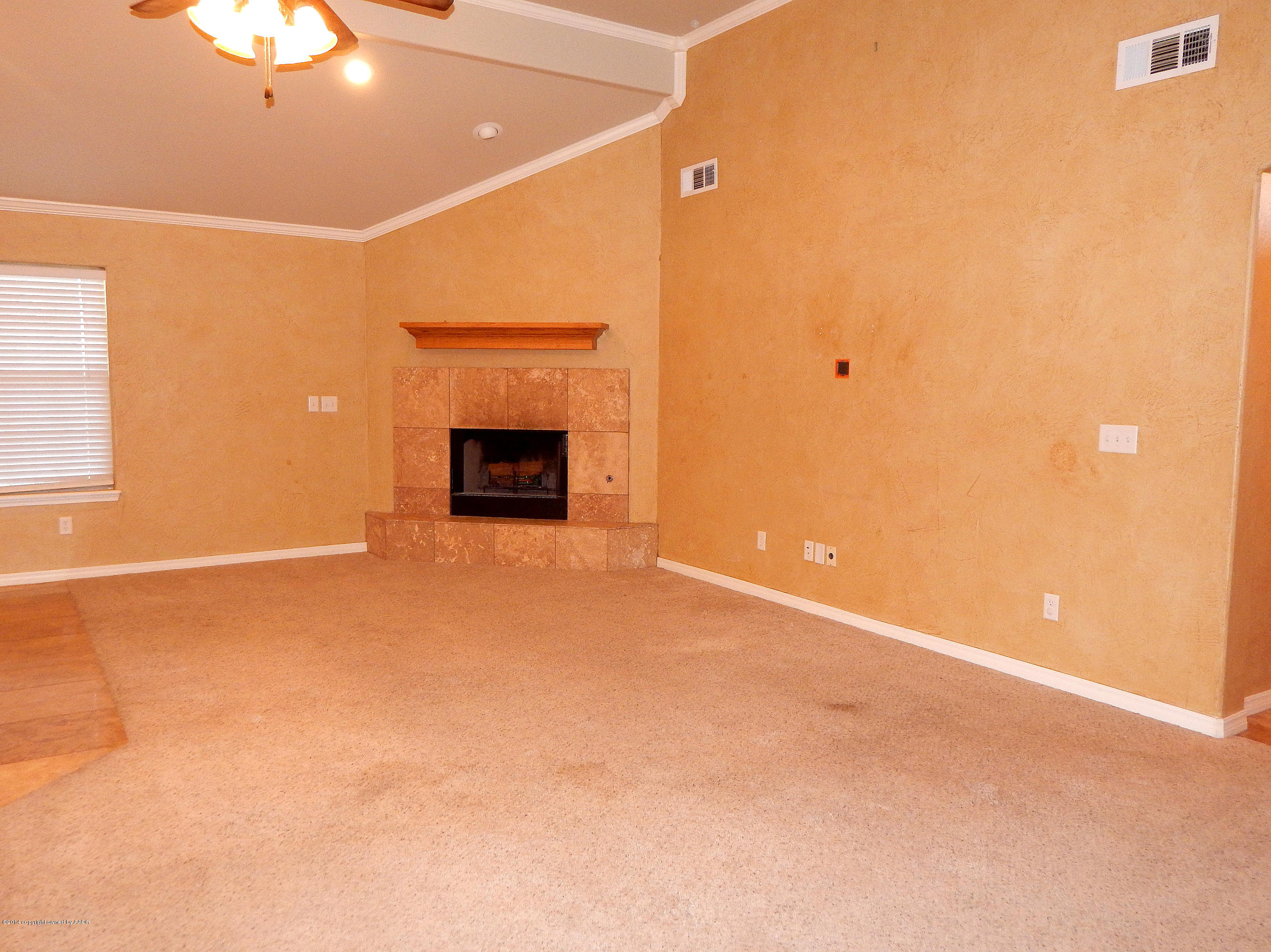 5302 Pleasant Court Amarillo, TX 79110 - Photo 6 of 22 a view of an empty room with a fireplace