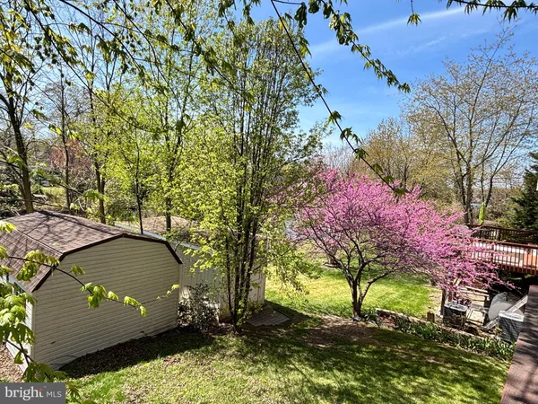 a view of hallway with wooden floor