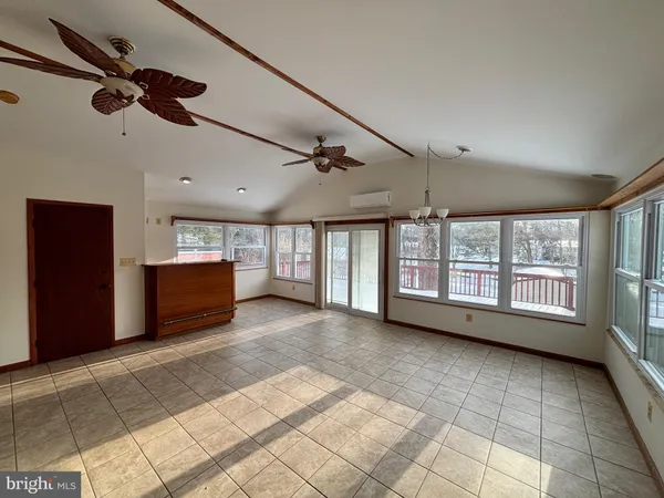 a kitchen with stainless steel appliances granite countertop a refrigerator a stove a sink and a microwave