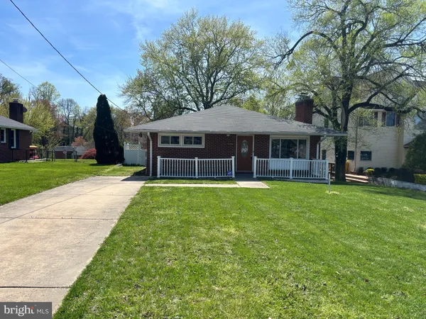 an aerial view of a house with a yard and garden