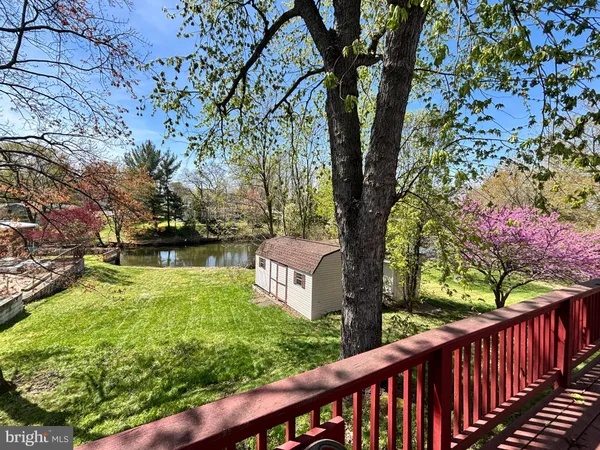 a view of balcony with wooden floor and fence