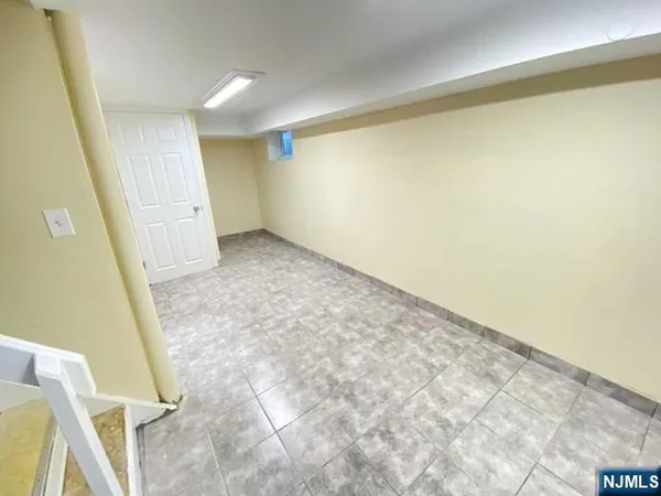 a view of a room with wooden floor and chair