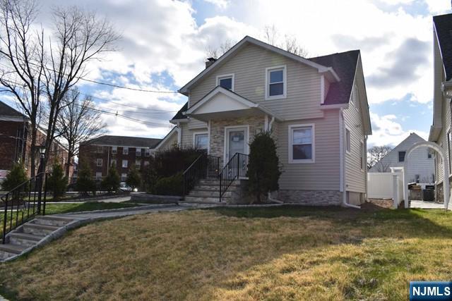 52 Day Street Clifton, NJ 07011 - Photo 18 of 19 a front view of house with yard