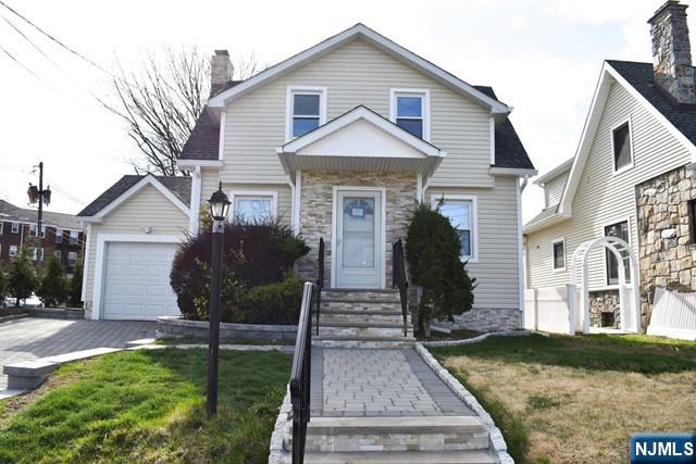 52 Day Street Clifton, NJ 07011 - Photo 2 of 19 a front view of a house with garden