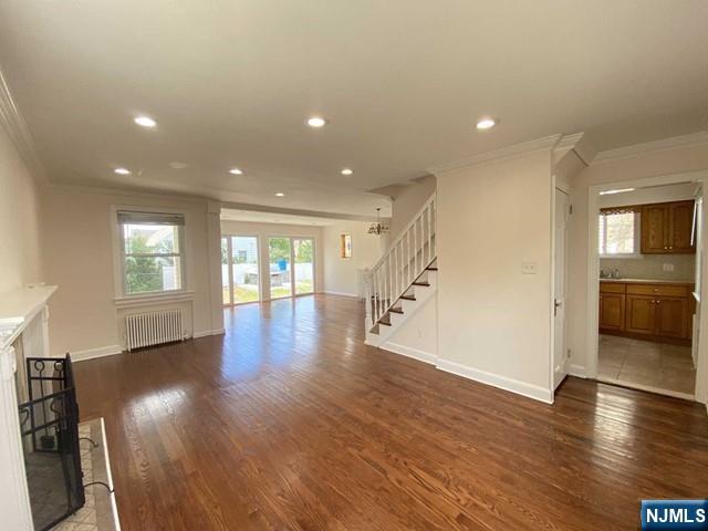 52 Day Street Clifton, NJ 07011 - Photo 7 of 19 an empty room with wooden floor and windows