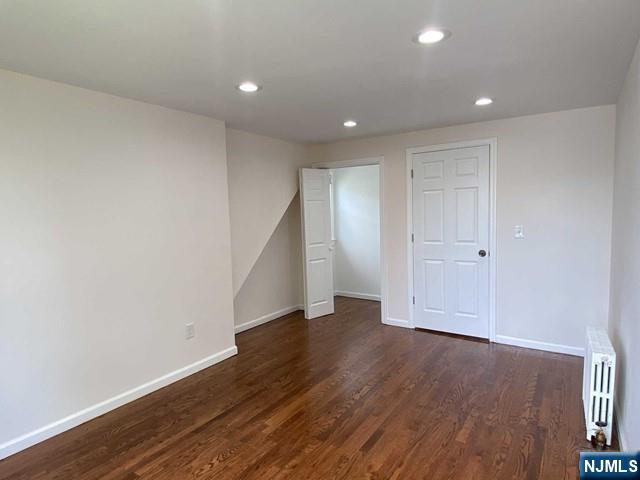 52 Day Street Clifton, NJ 07011 - Photo 10 of 19 a view of an empty room with wooden floor