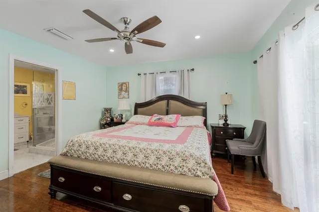 a bedroom with a bed and window