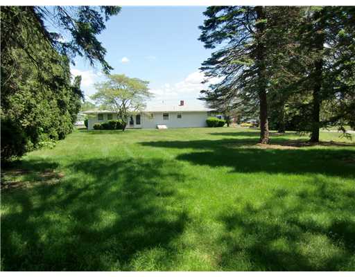 167 Durfee Road Tiverton, RI 02878 - Photo 2 of 9 Exterior Back. Huge backyard with mature trees.
