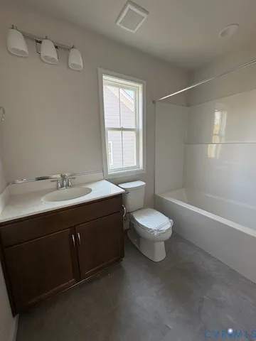 a bathroom with a double vanity sink toilet and shower