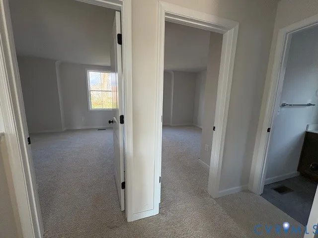 a view of a hallway with a room