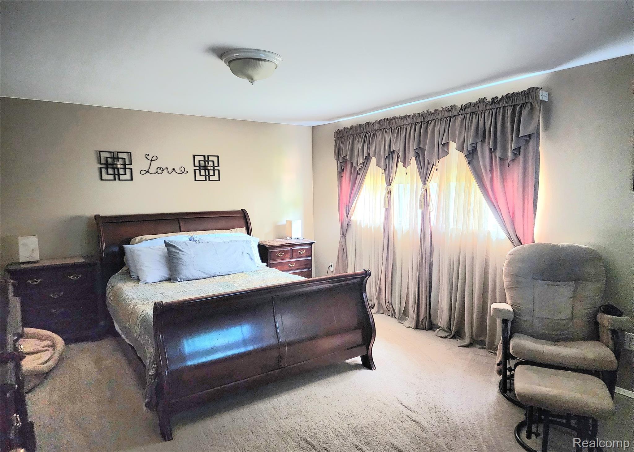 3333 Innsbrook Drive Rochester, MI 48309 - Photo 22 of 22 Carpeted room featuring a ceiling-mounted light fixture, neutral wall color, and a large window with privacy coverings