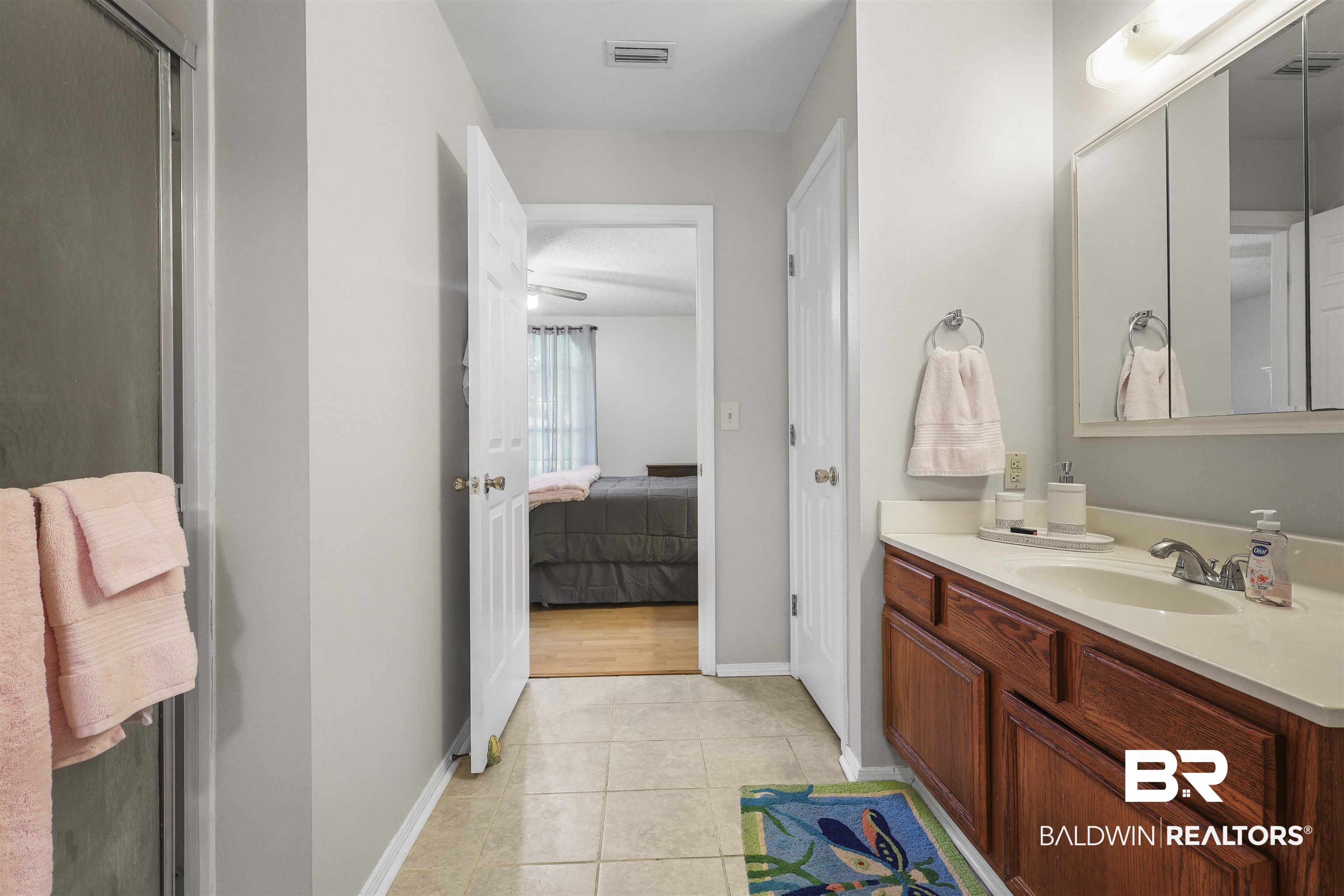 507 West Amanda Avenue Foley, AL 36535 - Photo 13 of 23 Bathroom featuring ceiling fan, vanity, and tile patterned flooring