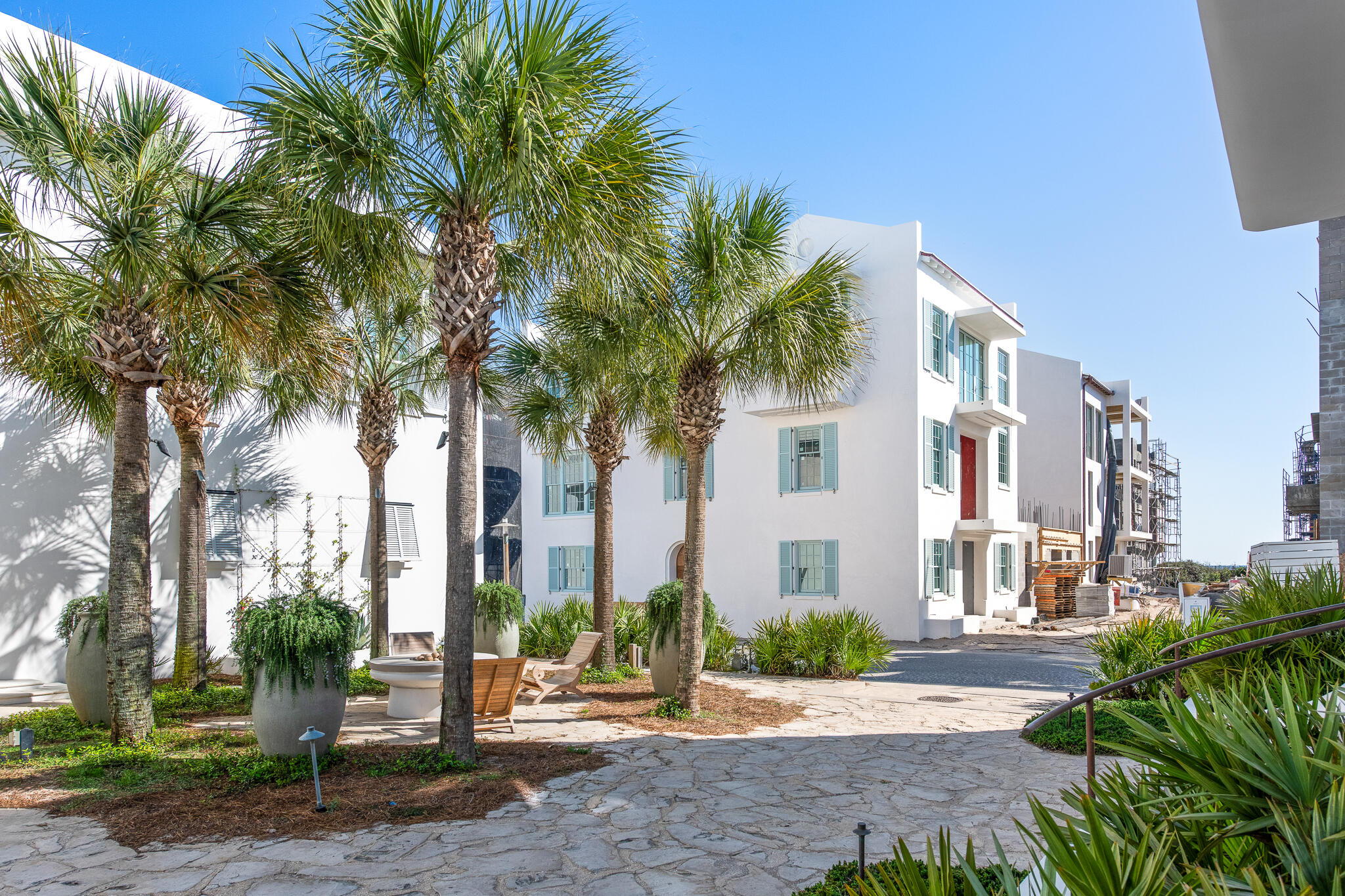 208 Sea Garden St Inlet Beach Inlet Beach, FL 32461 - Photo 2 of 16 a view of a palm trees in front of a building