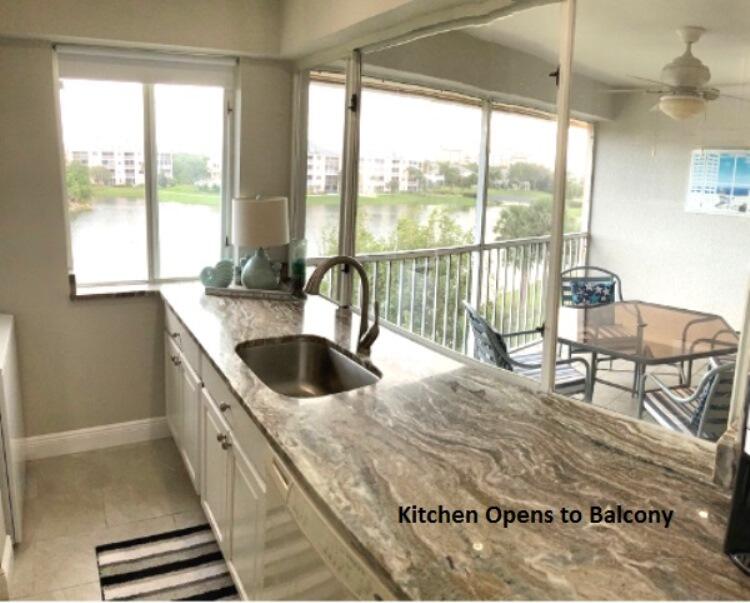353 Highway 1, Unit A408 Jupiter, FL 33477 - Photo 8 of 30 Kitchen Opens to Balcony