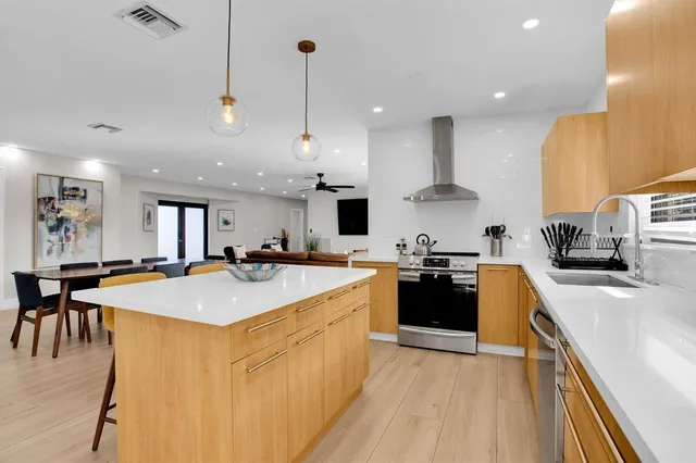 a front view of house with yard and trees