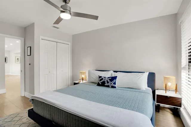 a bedroom with a bed and a television