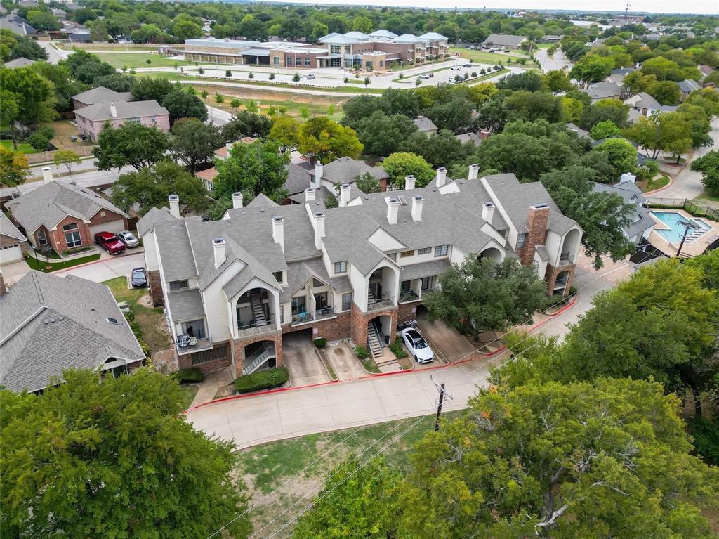 501 Arbor Creek Drive, Unit 204 Euless, TX 76039 - Photo 1 of 22 an aerial view of residential houses with outdoor space and street view
