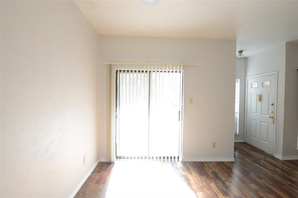 501 Arbor Creek Drive, Unit 204 Euless, TX 76039 - Photo 14 of 22 a view of a room with wooden floor and a window