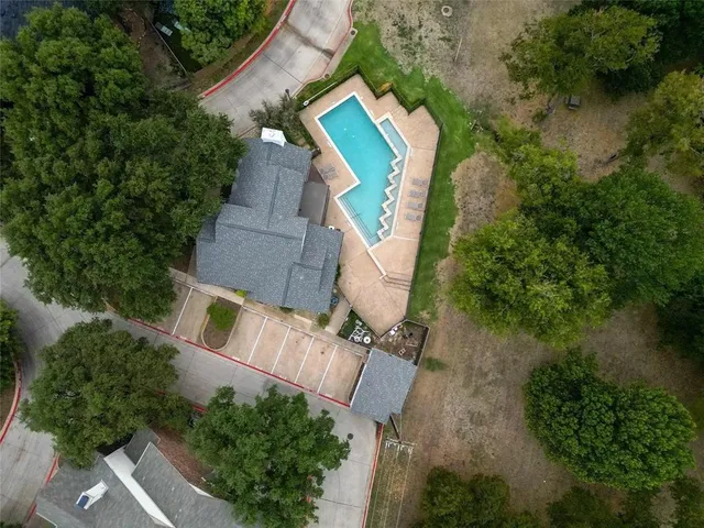 an aerial view of a house with a yard and garden