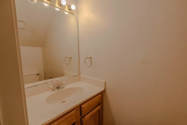 a bathroom with a sink and mirror