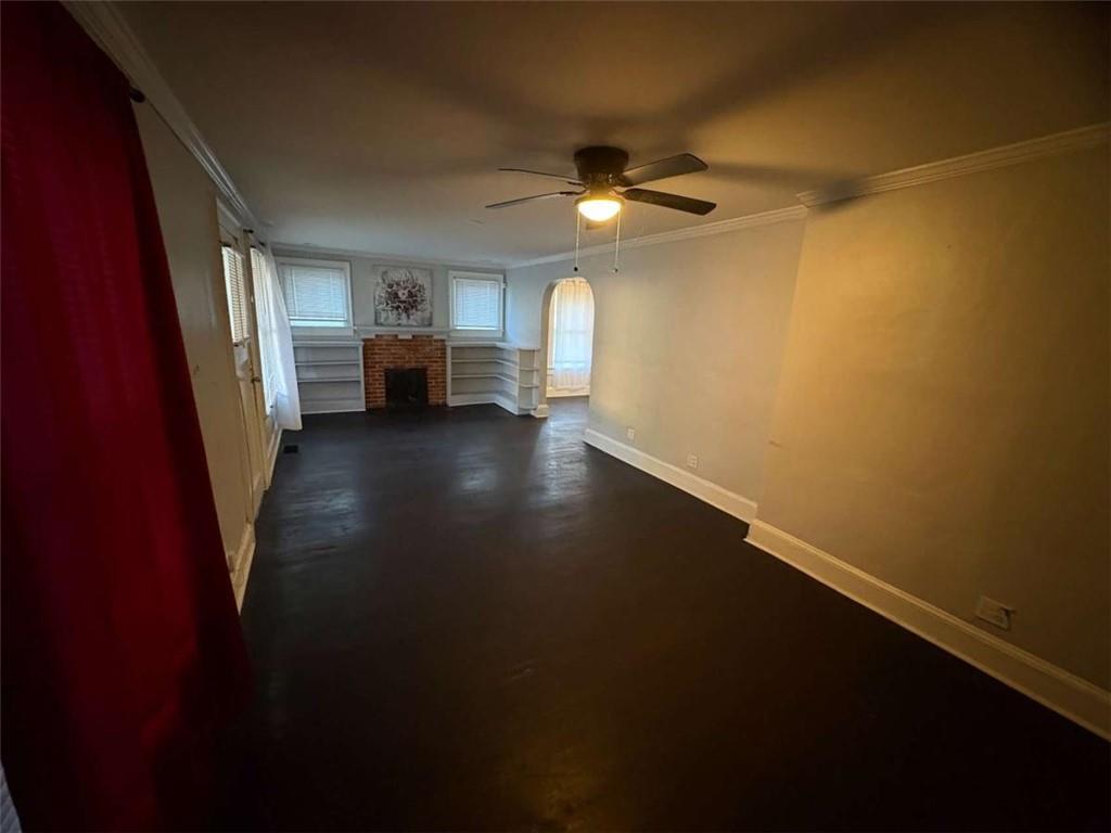 2421 Fairburn Road Southwest Atlanta, GA 30331 - Photo 3 of 15 wooden floor in an empty room with a window