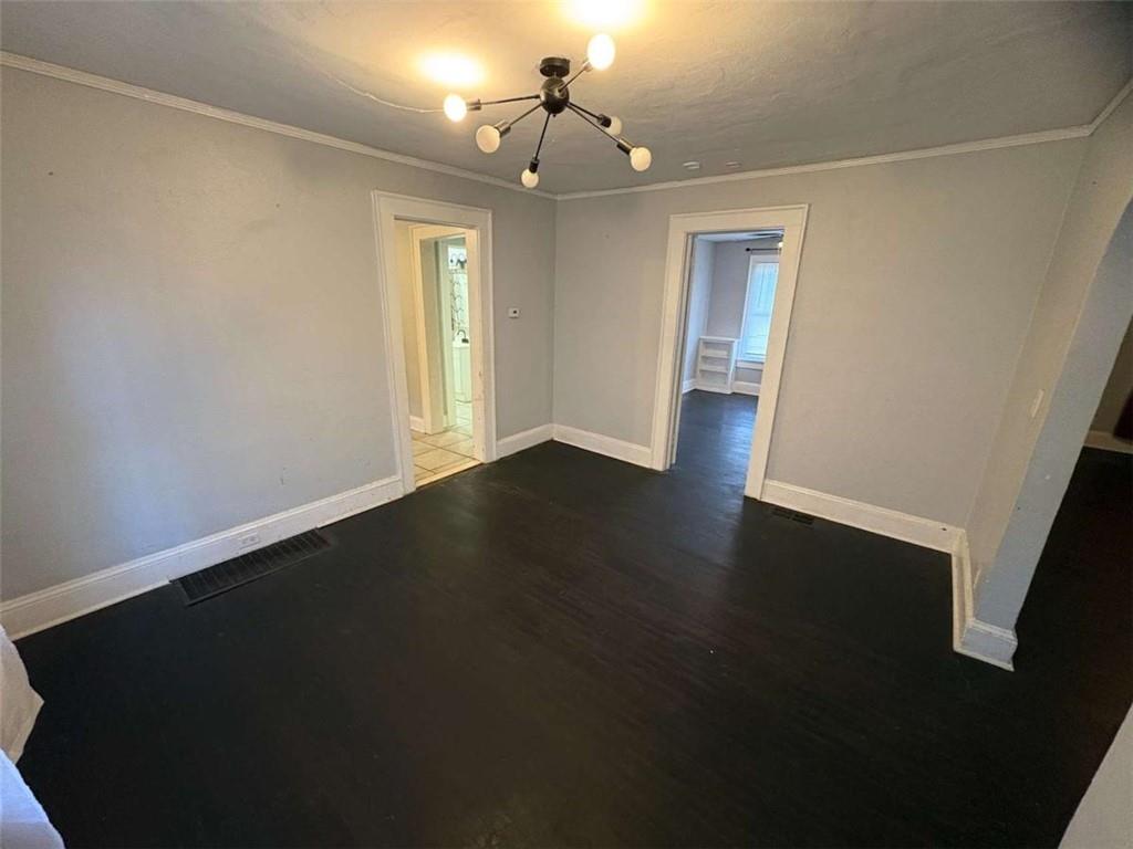 2421 Fairburn Road Southwest Atlanta, GA 30331 - Photo 6 of 15 a view of wooden floor and windows in a room