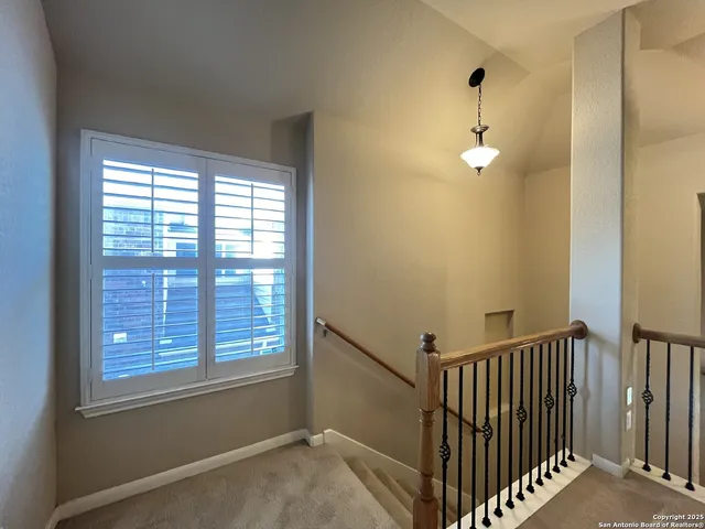 a view of empty room with windows
