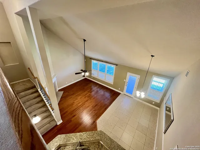 a view of an entryway with wooden floor