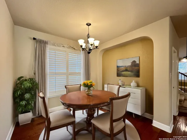 a dining room with furniture and window