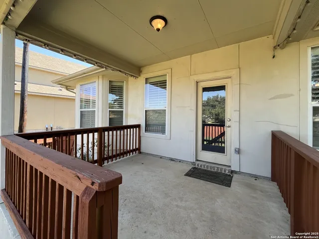 a view of a porch with wooden floor and stairs