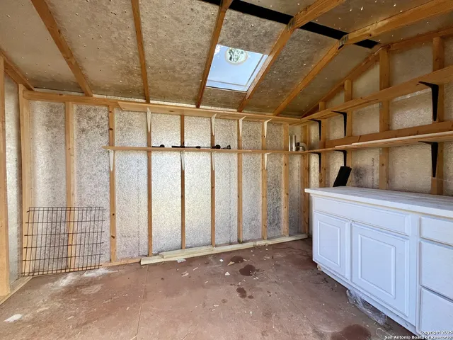 a view of a room with racks on the wall