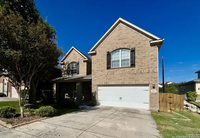 a front view of a house with garage