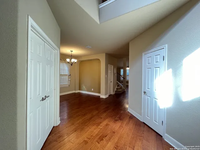 a view of entryway with wooden floor